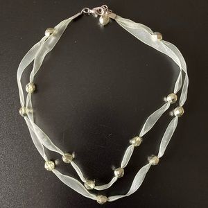 Light green ribbon and clear bead necklace
